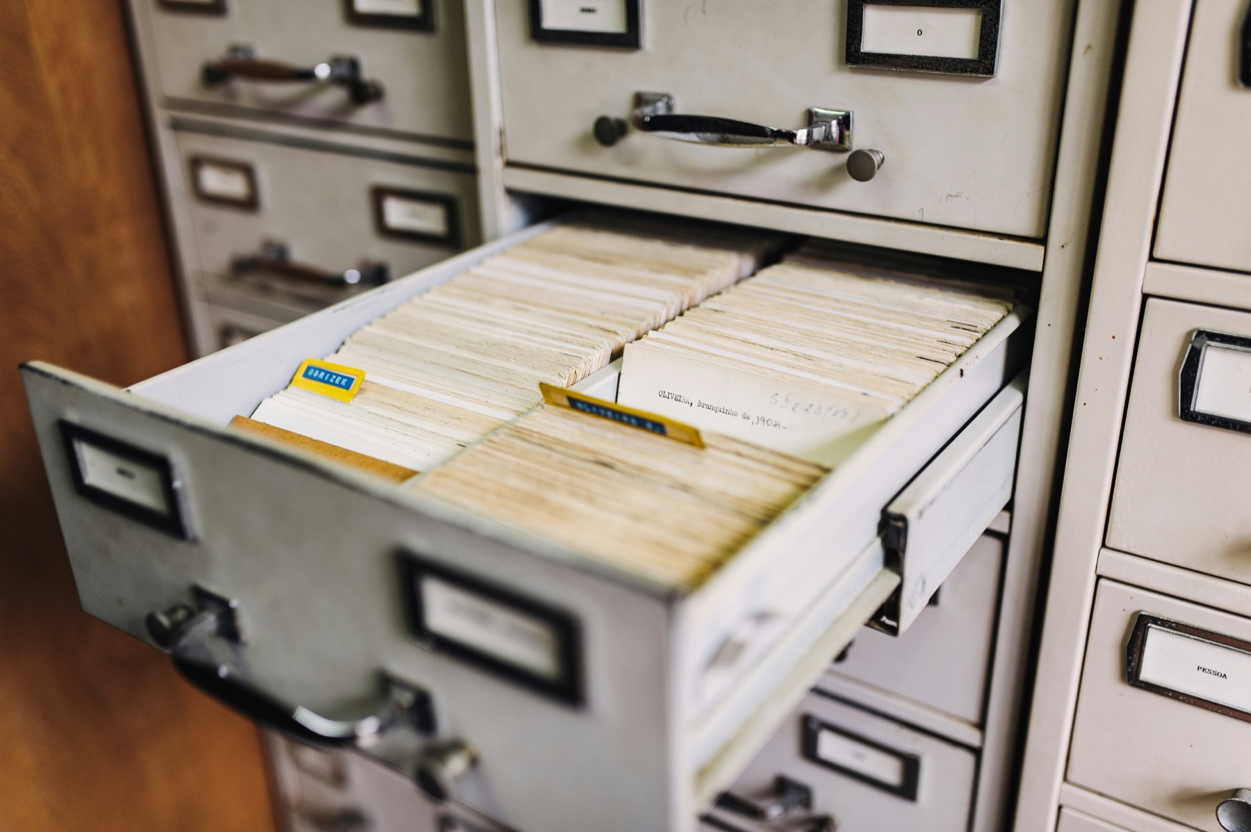 Open filing cabinet drawer with index cards, representing trade registry records in Turkey